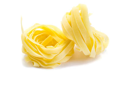Ribbon pasta isolated on white backgroundの写真素材