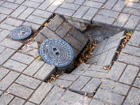 Road with road damage holeの写真素材