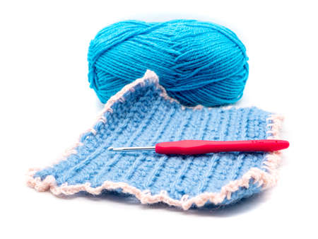 Pot holder with crochet hook and wool isolatedの写真素材