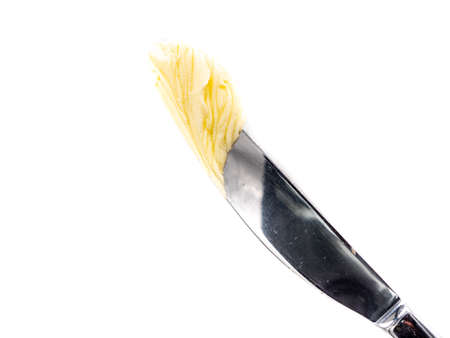 Knife with butter isolated on white backgroundの写真素材