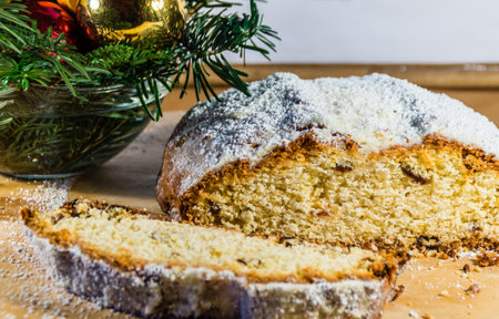 Christmas stollen on wooden background.の写真素材