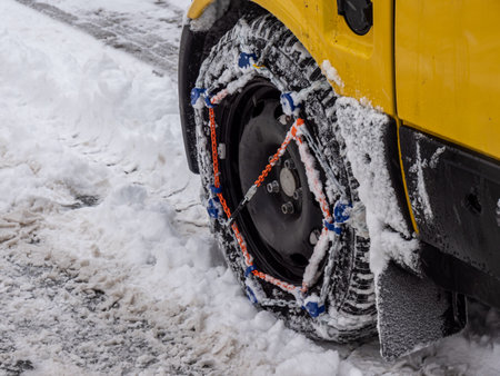 Car with snow chains on the winter tires