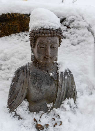 Buddha figure in the snowの写真素材