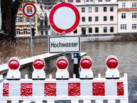 Caution flood warning sign due to melting snowの写真素材