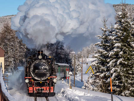 Steam locomotive in a winter landscapeの写真素材