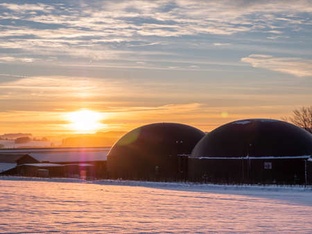 Biogas plant in the winter sunsetの写真素材