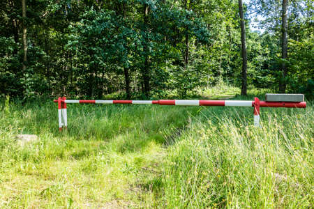 Barrier green forest path closed