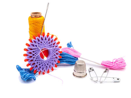 Sewing accessories isolated on white background