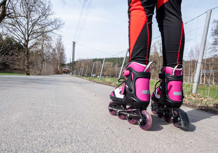 Girl inline skating on asphaltの写真素材