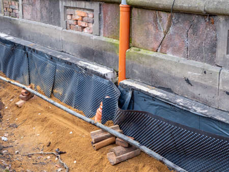 Moisture protection on a house is being renewedの写真素材