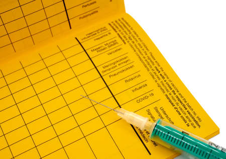 blank vaccination book with entry and syringe