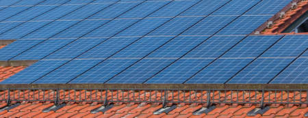 many solar panels on a roof