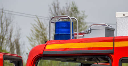 Emergency vehicle of the fire brigade with siren