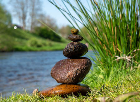 Balance stones on a river backgroundの写真素材