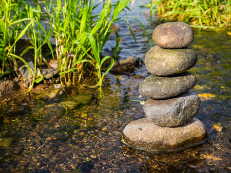 Balance stone in a riverの写真素材
