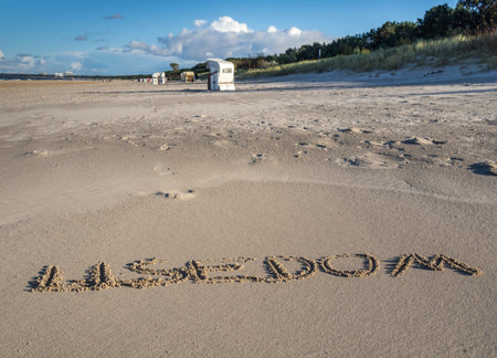 The word Usedom written in the sandの写真素材