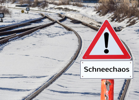 Snow chaos warning sign on the railway in Germanの写真素材