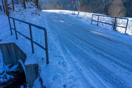 Danger of an icy bridge in winterの写真素材