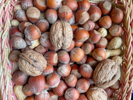 close up of hazelnuts and walnuts on the marketの写真素材