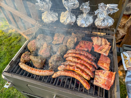 grilled meat on the grill in the gardenの写真素材