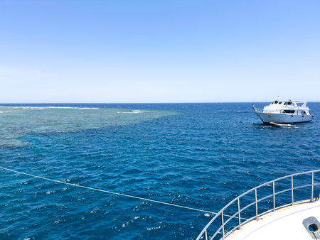 luxury yacht on the Red Sea in Egypt with coral reef on the backgroundの写真素材