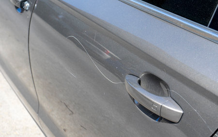 vandalism scratches on a car doorの写真素材