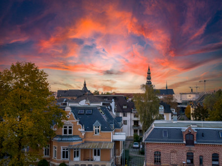 Above the roofs of Zwickau in Saxony with the cathedral and sunriseの写真素材
