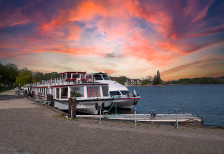 Ships in the harbor near Roebel on the Mueritz in the sunsetの写真素材
