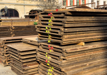 Stacks of wooden pallets on a construction siteの写真素材