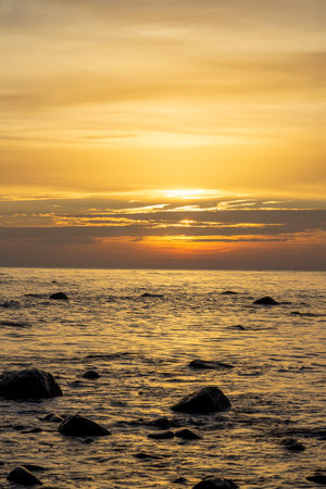 Sunset on the beach with large rocks in the water on the Baltic Sea on RÃ¼genの写真素材
