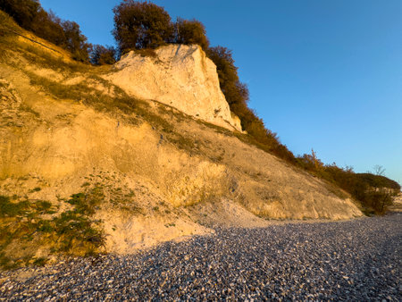 Chalk cliffs in Jasmund National Park are illuminated by the sun in autumn, Rügen Island, Baltic Sea, Beach Germanyの写真素材