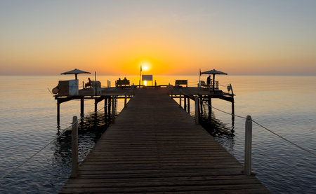 sunset on the pier on the house reef in Egypt, Red Sea travel guideの写真素材