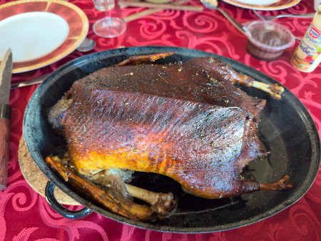 roast brown crispy duck on the holiday table food imageの写真素材