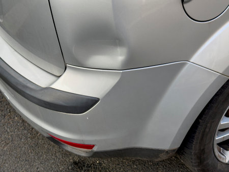 Large dent on a car after an accidentの写真素材