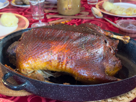 Christmas roast brown crispy duck on the holiday table food imageの写真素材
