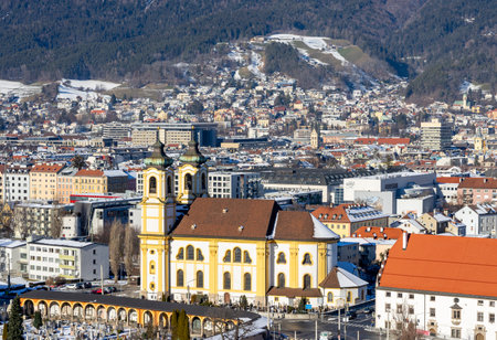 View of the city Innsbruck in Austria Tyrol with churchの写真素材