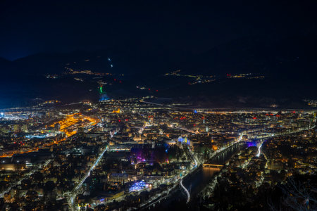 View of the city of Innsbruck in Austria Tyrol at nightの写真素材