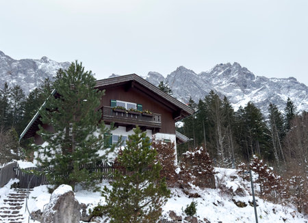 Old wooden house at the foot of the Zugspitze in the Alpsの写真素材