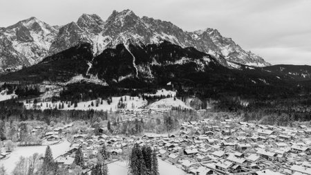 View of the town of Grainau with the Zugspitze in the background, Bavaria, German Alps black and whiteの写真素材