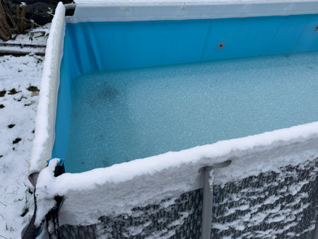 Frozen swimming pool in the gardenの写真素材