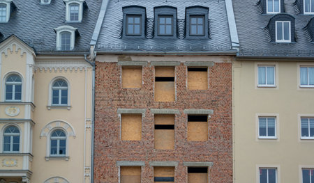 facade of a new house and old house contrast in the cityの写真素材