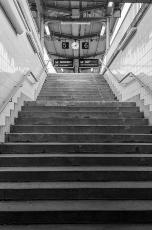 Stairway to the platforms in the train station Black and white photography verticalの写真素材
