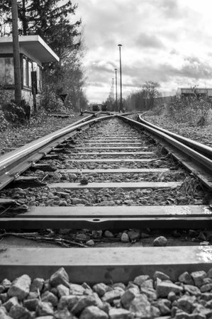 Old Abandoned Railway Track With Old Rails In Black And White Verticalの写真素材
