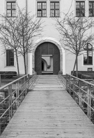 Wooden bridge at Osterstein Castle in black and white photography, Zwickau Saxony Germany verticalの写真素材
