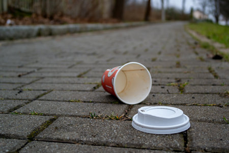 Environmental pollution "coffee to go" mug on the wayの写真素材