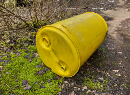old yellow barrel on the natureの写真素材