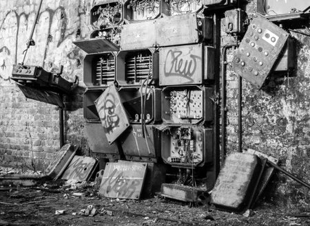 old abandoned factory hall with fuse box from the former GDR East Germanyの写真素材