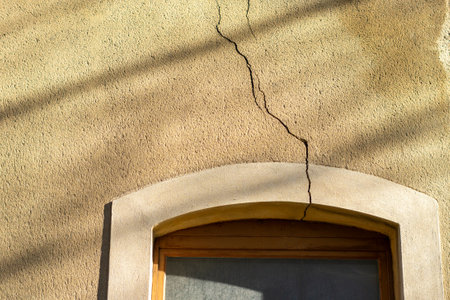 Crack in a wall on the window on the house construction defectsの写真素材