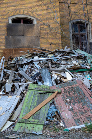 old abandoned factory rusty metal fence and old wooden demolition of construction site verticalの写真素材
