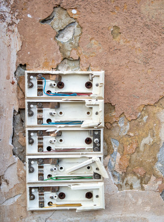Vandalism of a doorbell on an apartment building verticallyの写真素材